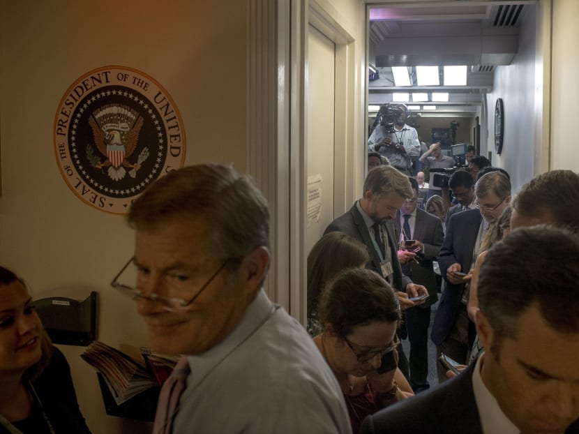 Reporters gather waiting for word on White House Press Secretary Sean Spicer's resignation, Washington, July 21, 2017. Spicer resigned Friday, telling President Donald Trump he vehemently disagreed with the appointment of New York financier Anthony Scaramucci as White House communications director. Photo: The New York Times