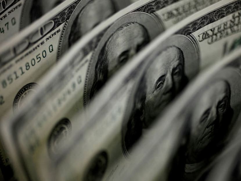 US dollar advances as Fed seen concluding asset buys sooner than expected