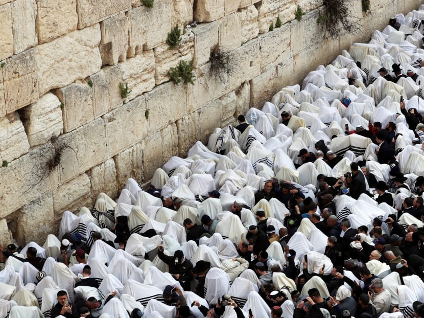 Photo of the day: Jewish worshippers cover themselves in their prayer shawls as they pray during a priestly blessing on the Jewish holiday of Passover at the Western Wall, Judaism's holiest prayer site, in Jerusalem's Old City on Monday, April 22, 2019.