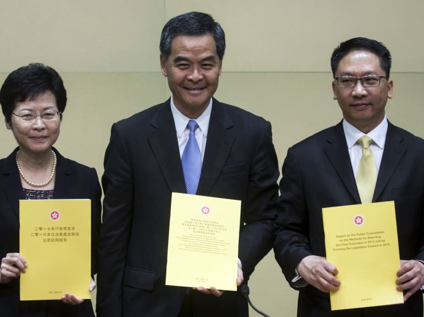 Justice Secretary Rimsky Yuen (far right) stoked opponents by likening the rail link, which will see mainland laws enforced in a Hong Kong train station, to the relationship between a landlord and tenant. Photo: Reuters