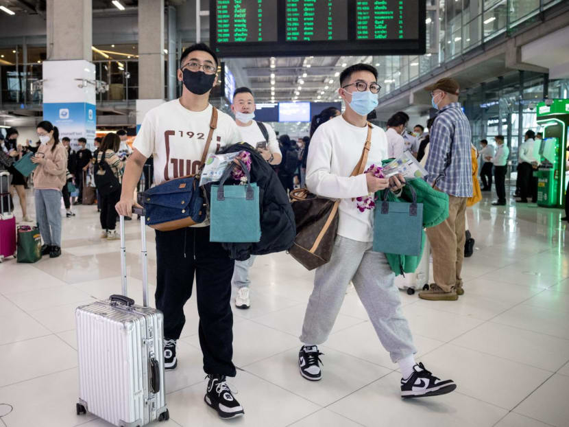 Travellers from a Xiamen Airlines flight arrive at Suvarnabhumi Airport in Bangkok on Jan 9, 2023, as China removed Covid-19 travel restrictions.