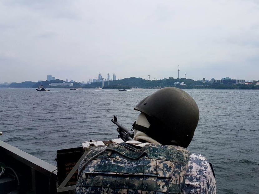 A gunner from the Republic of Singapore Navy RSS Fearless keeping watch over the waters off Sentosa during the Trump-Kim Summit on June 12.