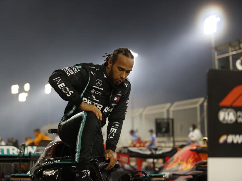 Mercedes' British driver Lewis Hamilton steps out of his car after winning the Bahrain Formula One Grand Prix at the Bahrain International Circuit in the city of Sakhir on Nov 29, 2020.