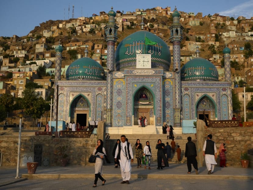 Shi'ite families leave the Sakhi Shah-e Mardan Shrine and mosque in Kabul on July 24, 2022. Shi'ite families leave the Sakhi Shah-e Mardan Shrine and mosque in Kabul on July 24, 2022.