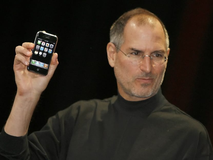 Apple's former chief executive Steve Jobs unveiling the first iPhone at the Macworld Conference on Jan 9, 2007, in San Francisco, California. Photo: AFP