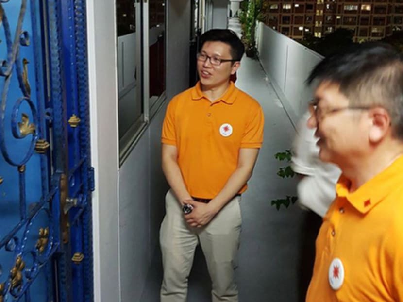 The National Solidarity Party's secretary-general Spencer Ng (centre) during an earlier round of resident visits. The party will continue with plans to visit residents while exercising appropriate Covid-19-related precautions.