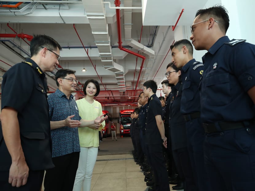 Deputy Prime Minister Heng Swee Keat said he will unveil several measures to support companies and help workers stay in their jobs in his Budget statement on Tuesday. He is seen here with Senior Parliamentary Secretary for Home Affairs Sun Xueling, interacting with frontline officers from the Singapore Civil Defence Force during a visit to the Kallang Fire Station on Sunday.