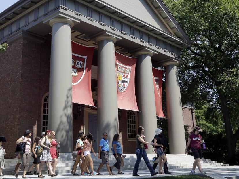 In this 2012, file photo, people tour on the campus of Harvard University in Cambridge, Massachussets. On May 15, 2015, the Asian-American group filed a federal discrimination action against Harvard University claiming racial bias in undergraduate admissions. Photo: AP