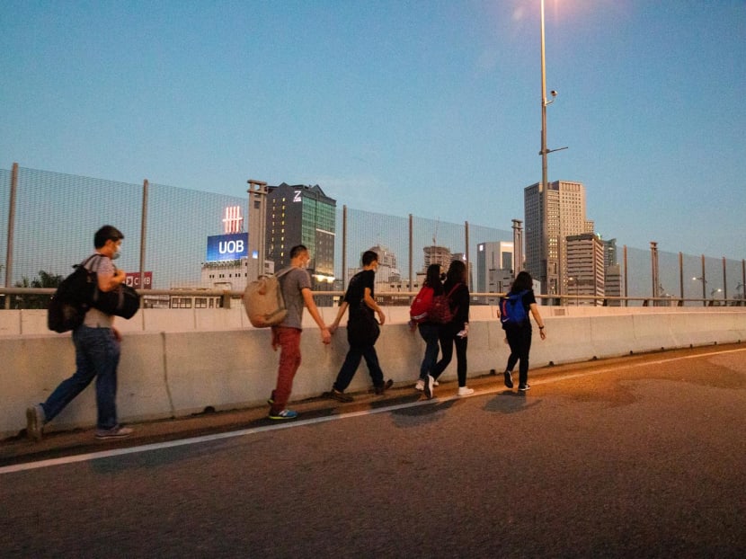 People walking to Malaysia from Woodlands Checkpoint on April 1, 2022.