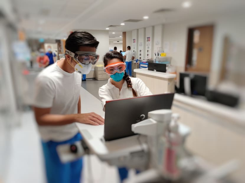 Dr Puah Ser Hon (left), a respiratory physician, and Ms Emelin Tan (right), a senior respiratory therapist, in a ward at the National Centre for Infectious Diseases.