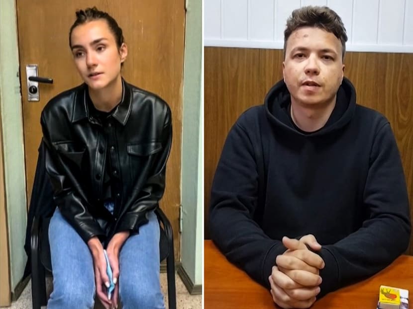 Belarusian activist Roman Protasevich (right) and his girlfriend Sofia Sapega testify to the police in Minsk, seen in videos posted on Telegram and shared on social media.