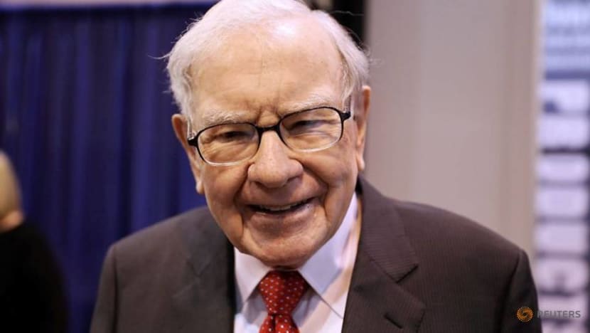 Buffett's firm sells off financials, halves Chevron stake