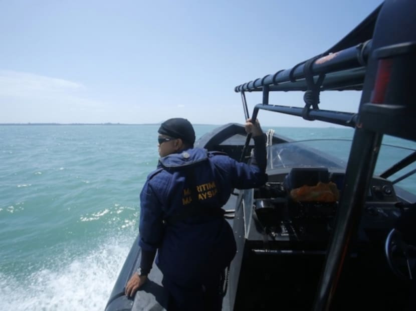 A Malaysia Maritime officer looks out into the sea during a search and rescue in Kuala Langat. Reuters file photo