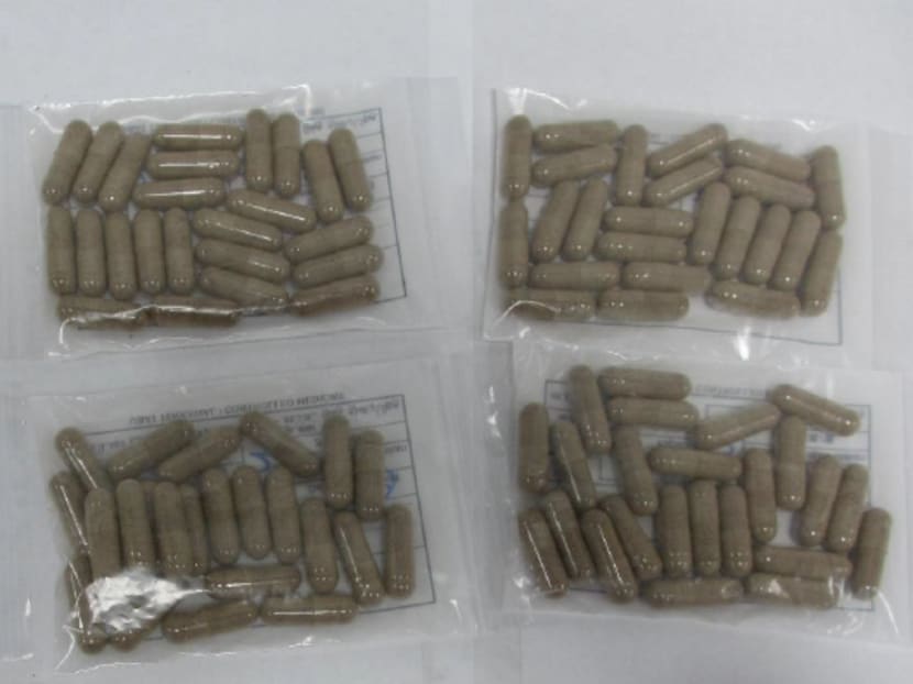 Illegal brown capsules in unlabelled plastic pill pouches. Photo: Health Sciences Authority