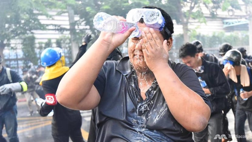 In photos: Thai protesters, police clash outside parliament In photos: Thai protesters, police clash outside parliament