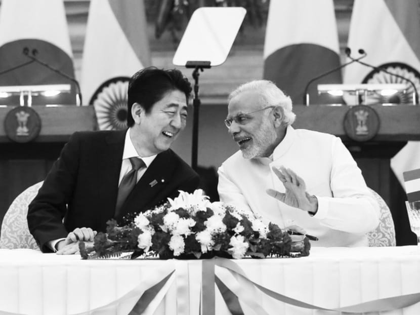 Japanese PM Shinzo Abe with his Indian counterpart, Mr Narendra Modi. An economically surging India 

and a more politically assertive Japan are the best candidates to constrain China’s ambitions. Photo: Reuters