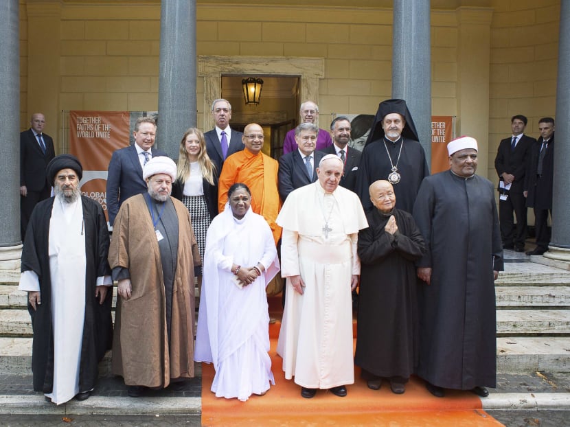 Pope Francis (2nd right) poses with religious leaders during a meeting at the Pontifical Academy of Sciences at the Vatican on Dec 2, 2014. Photo: Reuters