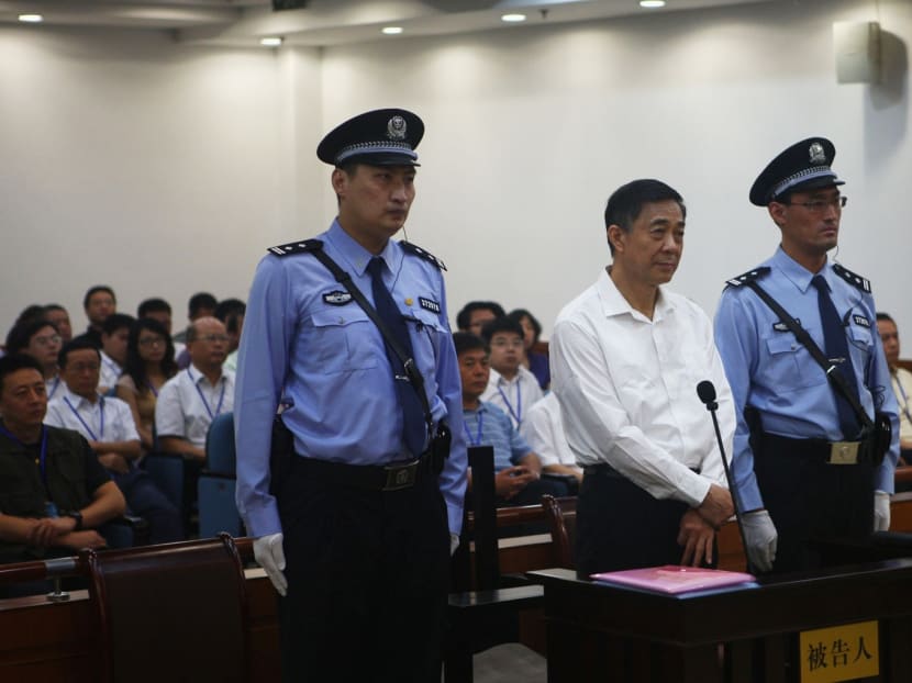 Disgraced Chinese politician Bo Xilai stands trial inside the court in Jinan, Shandong province Aug 22, 2013, in this photo released by Jinan Intermediate People's Court. Photo: Reuters