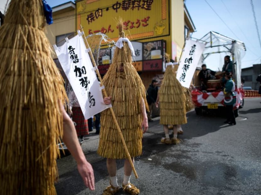 Photo of the day: Participants dressed in "Kendai" or bird-shaped straw coats dance to taiko drumming during the 'Kasedori Festival' in Kaminoyama, Yamagata Prefecture, Japan, on Monday, Feb 11, 2019, to pray for good harvest, good fortune and fire prevention. Meanwhile, local people wait in the streets with buckets and ladles to splash cold water onto the performers.