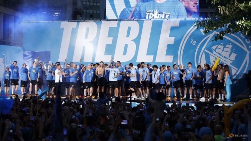 Manchester City dance in the rain to celebrate treble 