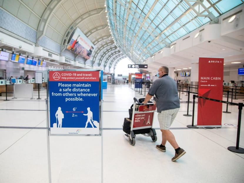 A man pushes a baggage cart wearing a face mask at Toronto Pearson International Airport in Toronto, Ontario, Canada on June 23, 2020. A man pushes a baggage cart wearing a face mask at Toronto Pearson International Airport in Toronto, Ontario, Canada on June 23, 2020.