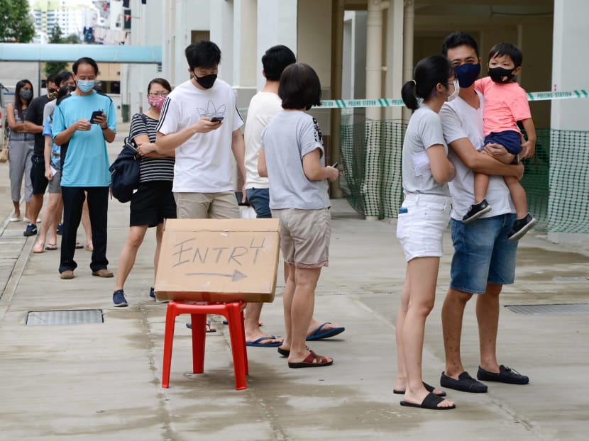 Voters queue outside a polling station on Petir Road in Bukit Panjang on July 10, 2020.