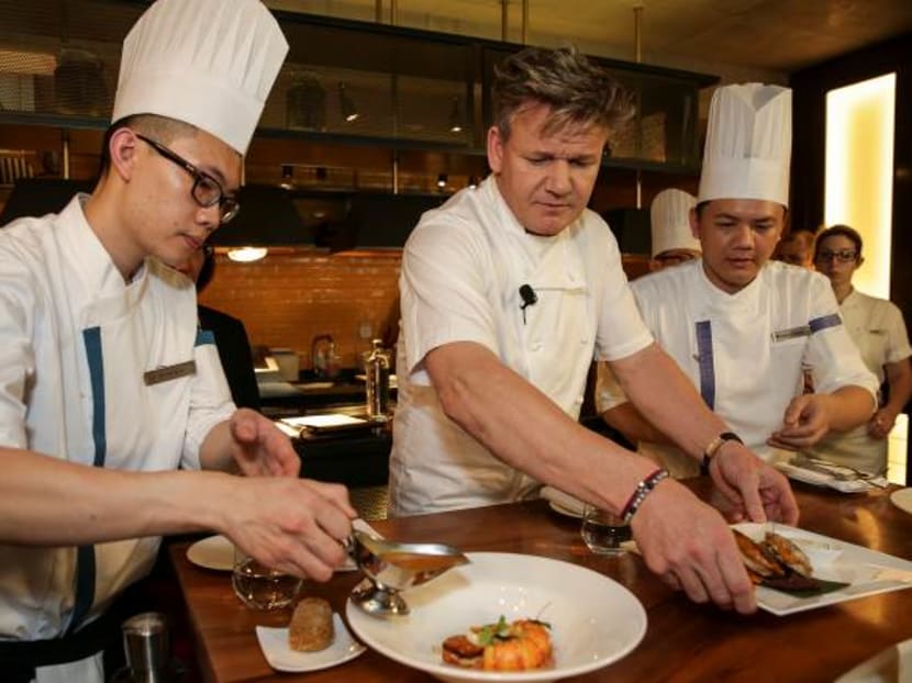 Celebrity Chef Gordon Ramsay was in town for the inaugural Marina Bay Sands Culinary Olympics at Bread Street Kitchen, the restaurant he opened in Singapore in 2015. His is shown here with Steven Low Chee Wen (far left) and Foong Man Chung. Photo: Marina Bay Sands