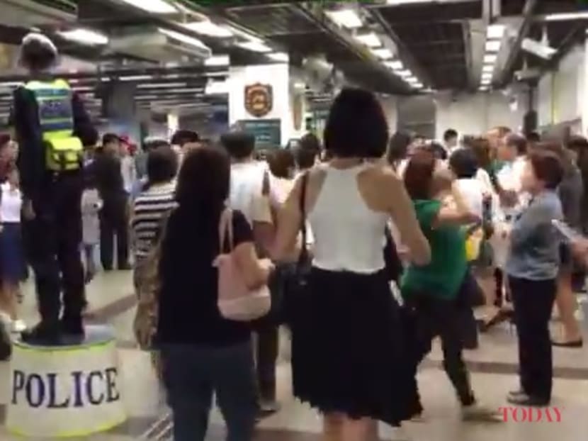 Officers divert public to exit at City Hall MRT Station via Exit B