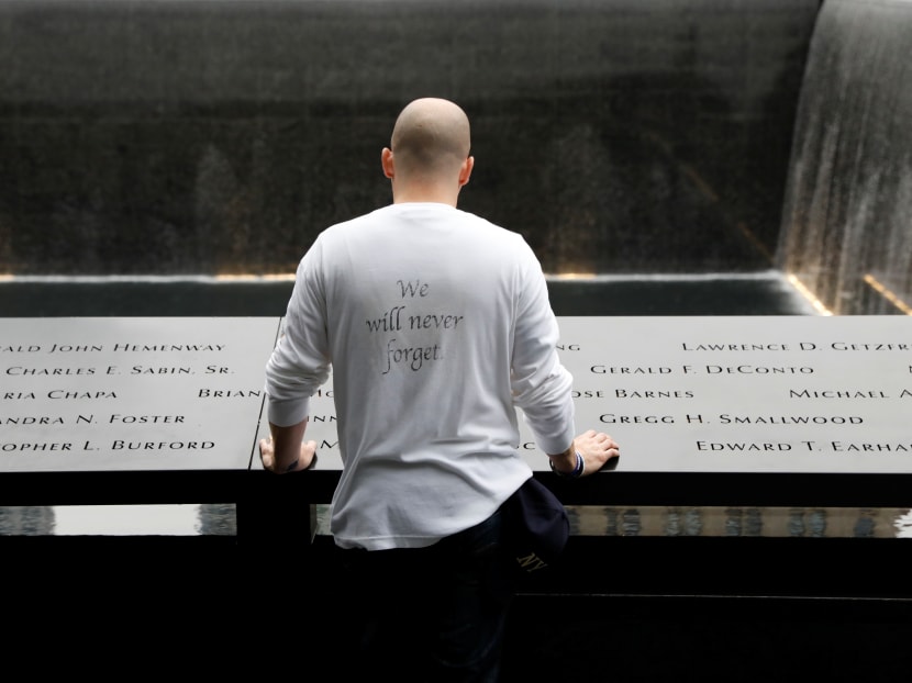 Photo of the day: A guest pausing among names at the edge of the north reflecting pool at the National 9/11 Memorial and Museum in New York on Tuesday (Sept 11), during ceremonies marking the 17th anniversary of the Sept 11, 2001 attacks on the World Trade Center.