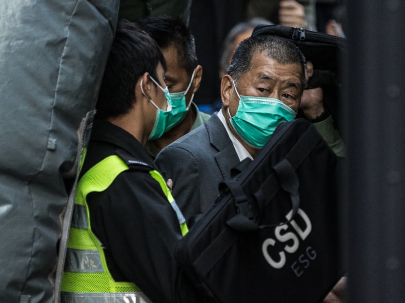 Media tycoon Jimmy Lai (right) is escorted into a Hong Kong Correctional Services van outside the Court of Final Appeal in Hong Kong on Feb 1, 2021, after being ordered to remain in jail while judges consider his fresh bail application, the first major legal challenge to a sweeping national security law Beijing imposed on the city last year.