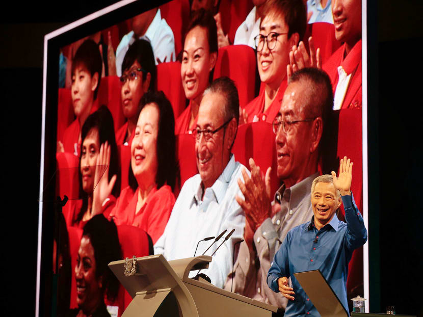 Prime Minister Lee Hsien Loong waves to May and Joseph Schooling during the National Day Rally 2016. Photo: Jason Quah