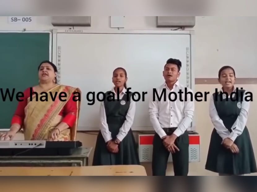 A screenshot of a video showing people in India singing a song that sounds close to Count on Me, Singapore.