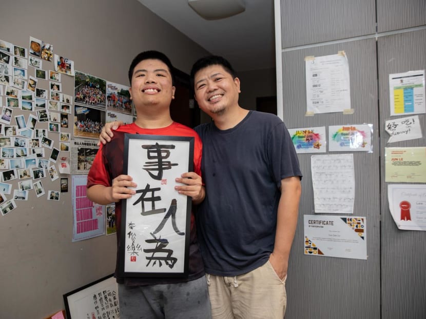 Mr Bob Lee Keng Siang (right) and his son Jun Le with his artwork on Sept 20, 2022. Mr Bob Lee Keng Siang (right) and his son Jun Le with his artwork on Sept 20, 2022.