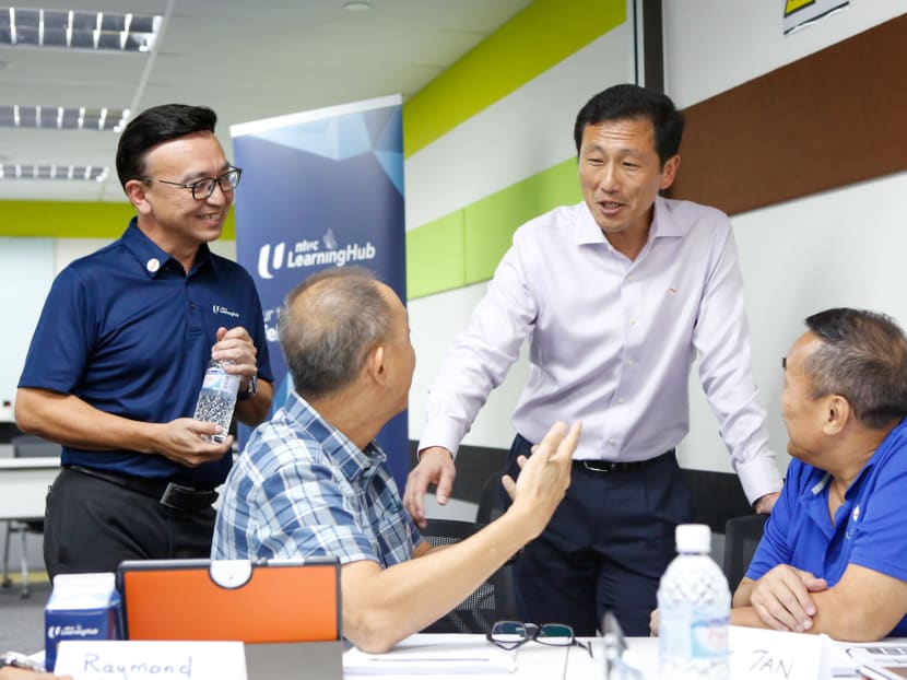 Education Minister Ong Ye Kung (second from right) speaking to students from the SkillsFuture for Digital Workplace course held at NTUC Learning Hub on Feb 24, 2020.