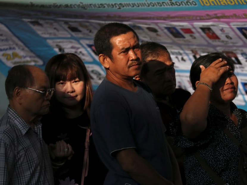 People queue up to vote at a polling station during the general election in Bangkok, Thailand, March 24, 2019.