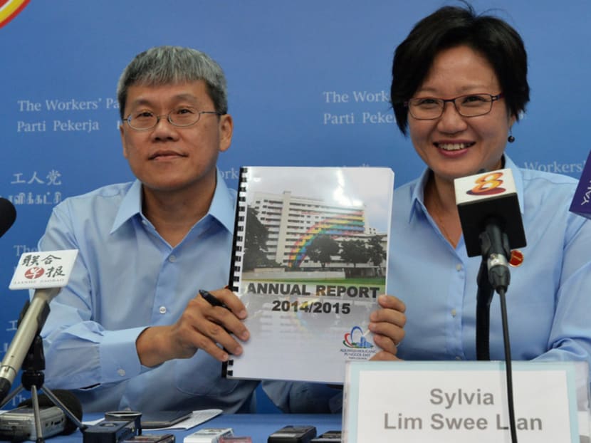 Ms Sylvia Lim (right) and Mr Png Eng Huat holding up WP's Annual Report for FY 2014/2015. Photo: Robin Choo