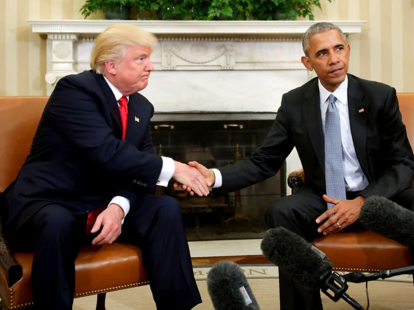 US President Barack Obama meeting Republican President-elect Donald Trump to update him on transition planning in the Oval Office at the White House on Nov 10. Photo: AFP