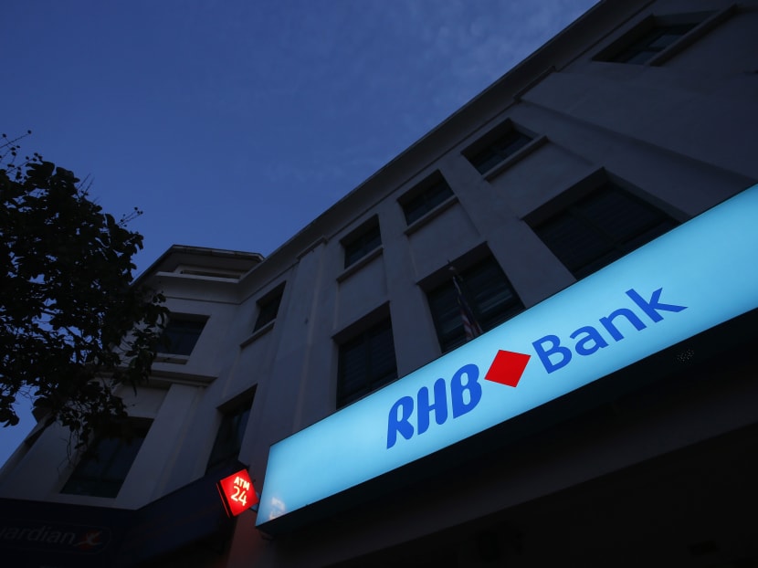 Malaysia's RHB Bank logo is seen at its branch in Kuala Lumpur. Malaysia's CIMB Group, RHB Capital Bhd and Malaysia Building Society Bhd (MBSB) have agreed on a merger deal that will create the country's biggest banking group. Photo: Reuters.