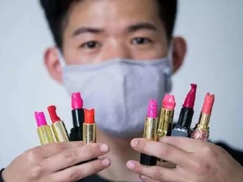 Mr Wang displying the pricey lipsticks. Photo: Handout via South China Morning Post