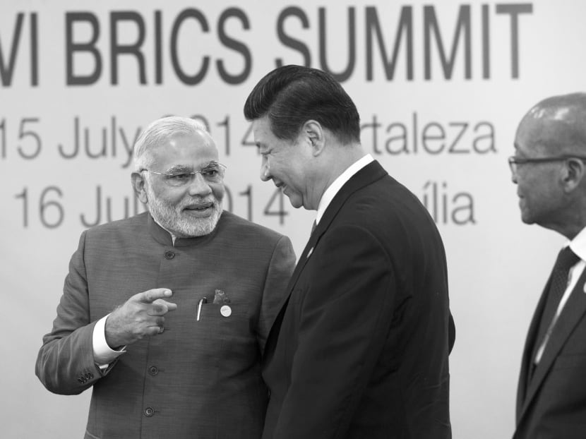 Mr Xi (right) is aware that Mr Modi enjoys good relations 
with Tokyo. It will not be in China’s interests if India and Japan 
move closer at its expense. Photo: AP