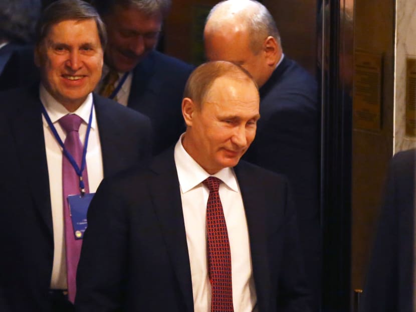 Russian President Vladimir Putin, front, walks during a break in talks in Minsk, Belarus on Thursday, Feb. 12, 2015. Photo: AP