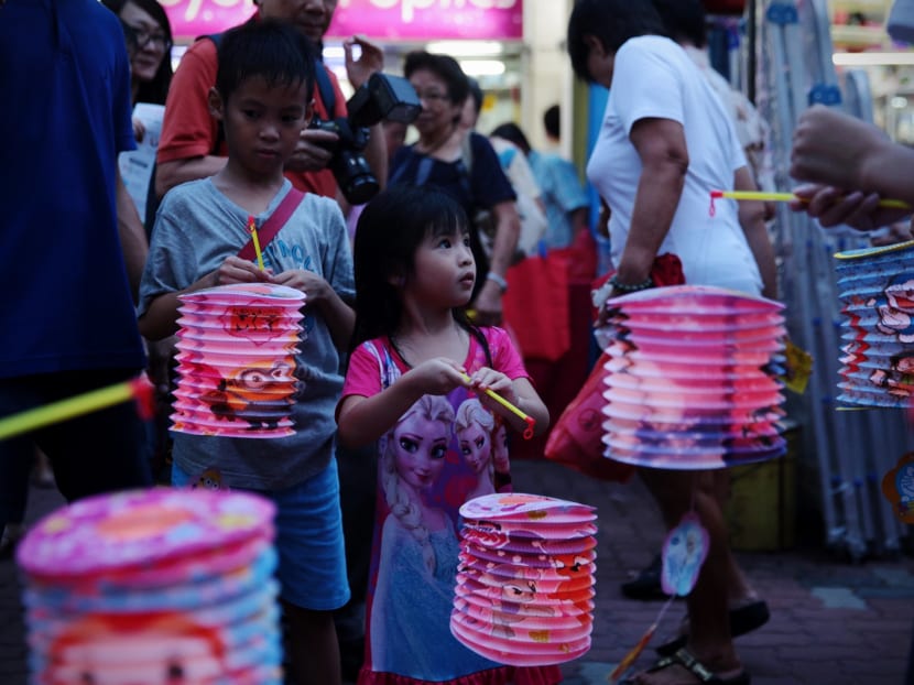 Children play with lanterns at Aljunied Crescent's Mid-Autumn festivities. Photo:Jason Quah