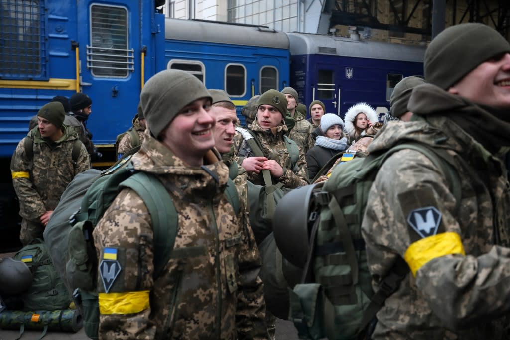 Ukrainian servicemen boarding a train in the western Ukrainian city of Lviv as they depart in the direction of the country's capital Kyiv on March 9, 2022, amid the ongoing Russia's invasion of Ukraine.
