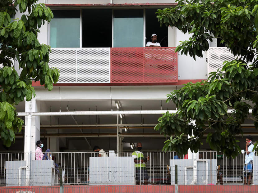 Migrant workers at Sungei Tengah Lodge, a foreign workers' dormitory.