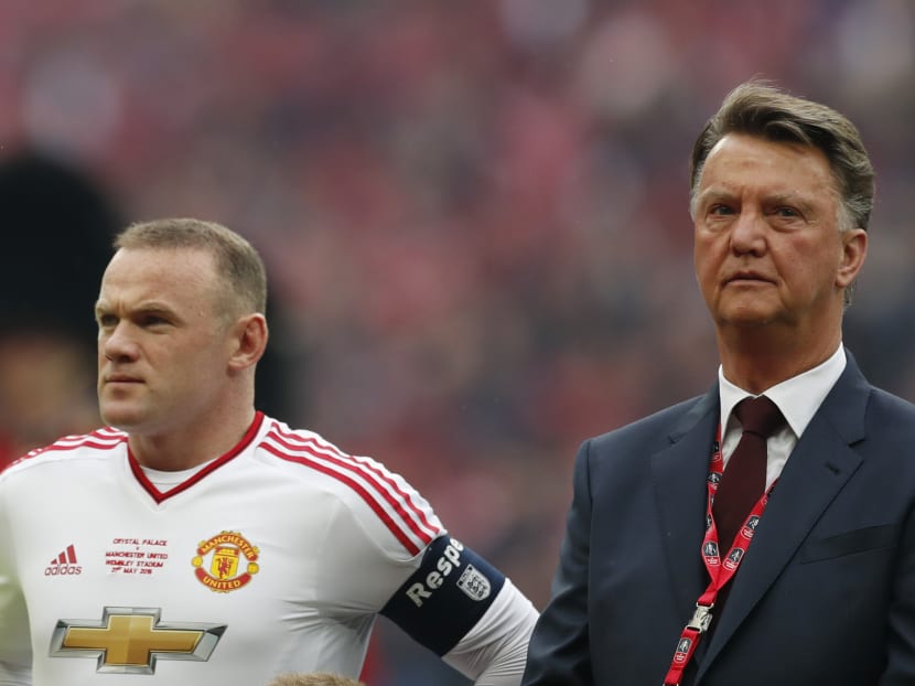 Louis van Gaal (right) with Manchester United captain Wayne Rooney at Wembley on Saturday. Photo: Reuters