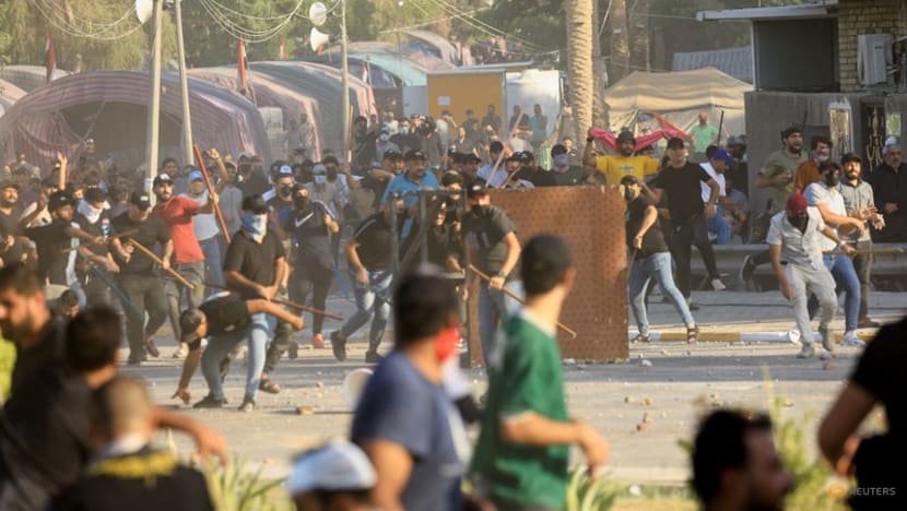 Clashes kill 10 as Iraq's Sadr quits politics, loyalists storm complex Clashes kill 10 as Iraq's Sadr quits politics, loyalists storm complex