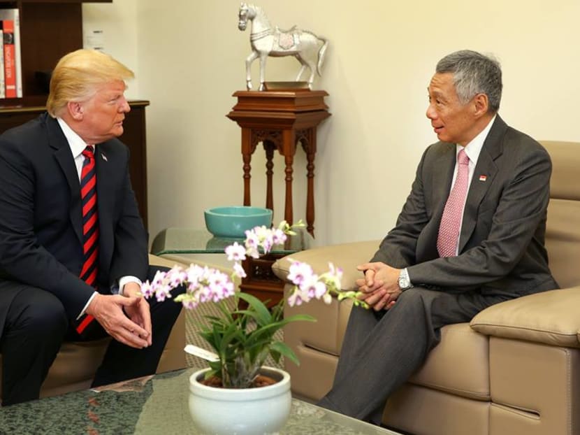 Prime Minister Lee Hsien Loong speaks with US President Donald Trump in the Istana on June 11, 2018.