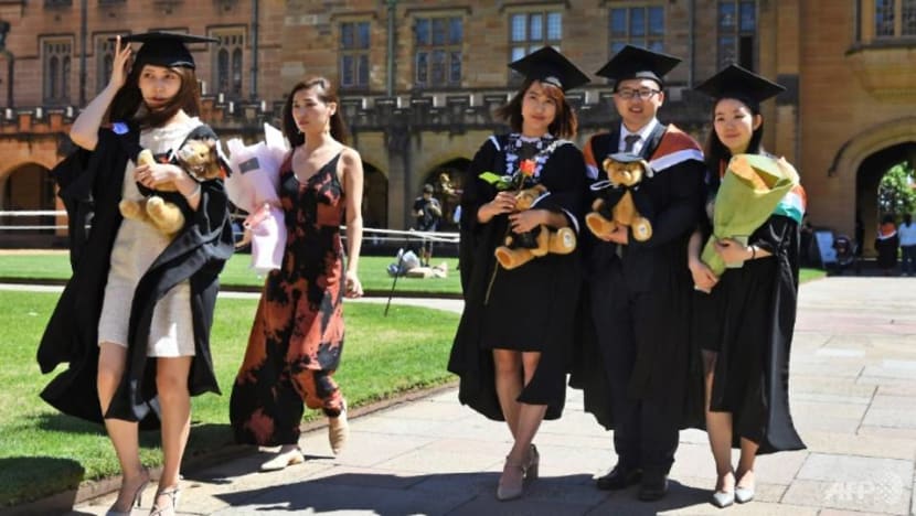 students from china pose for family photos after graduating from sydney university nearly 200000 chinese students are studying at australian universities bringing in much needed revenue 1564049097077 6