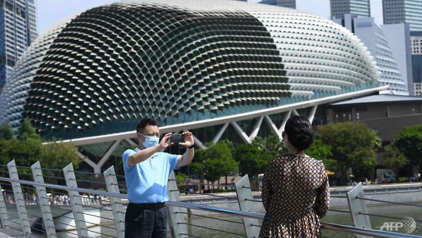US raises COVID-19 travel alert level for Singapore, Hong Kong