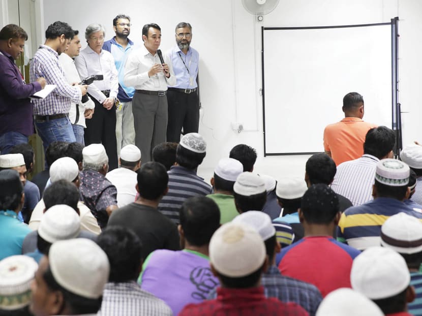 Ustaz Mohamed Ali from the RRG talking to Bangladeshi workers in their dorms earlier this year. Counsellors say most detainees were open to being rehabilitated and appreciated the religious discussions. Photo: Wee Teck Hian